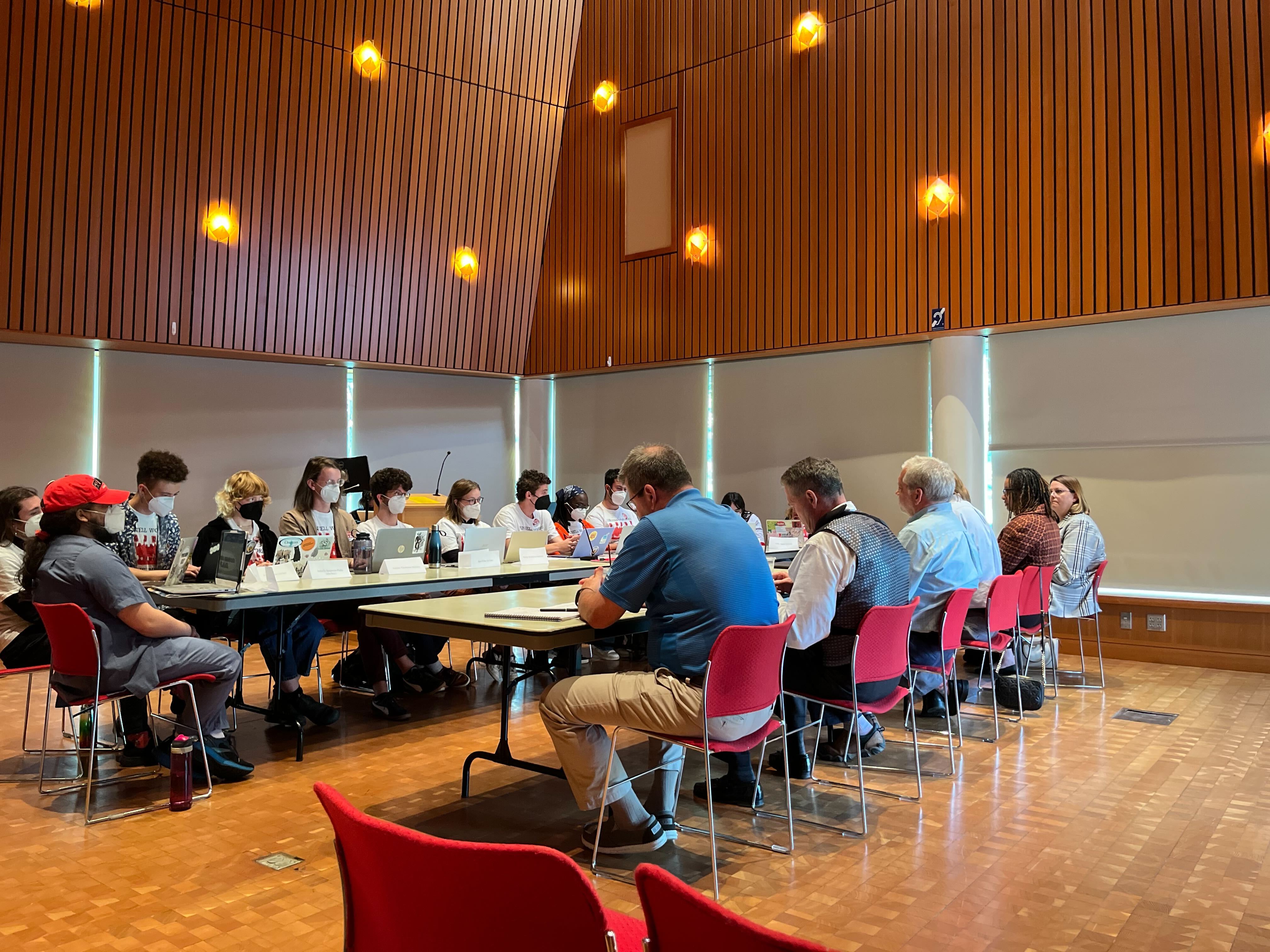 A photograph of UGSDW's bargaining team at the table in JRC 101, facing the College's Bargaining Team during the first bargaining session