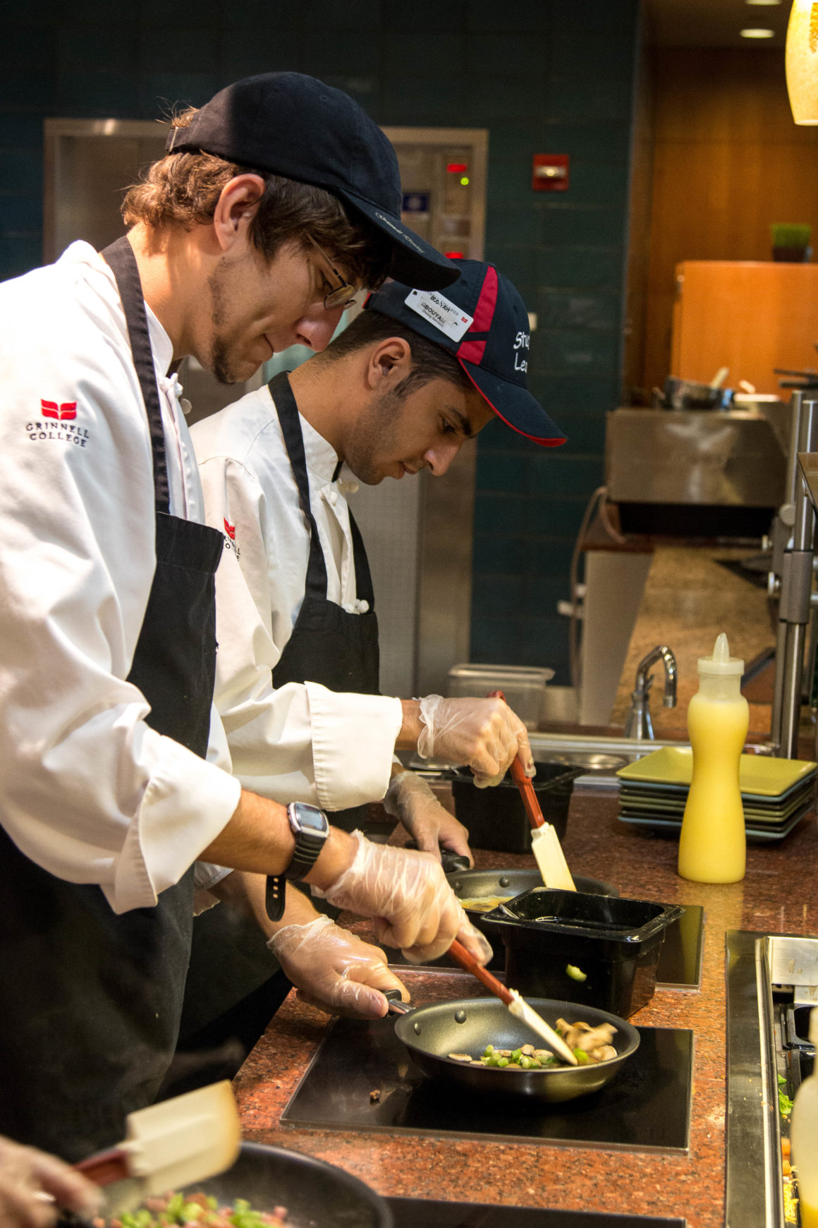 Workers at Grinnell's dining hall